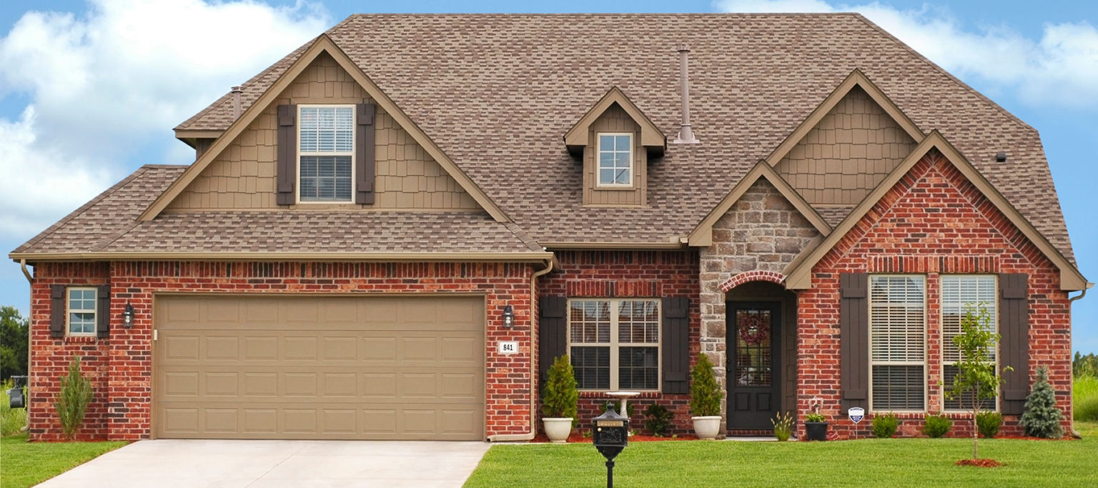 DoorLink traditional raised panel garage door in sandstone