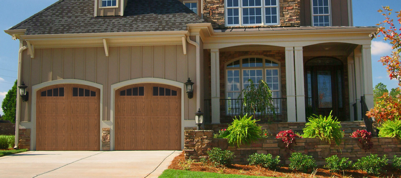 DoorLink 3640 long grooved panel garage door in oak finish